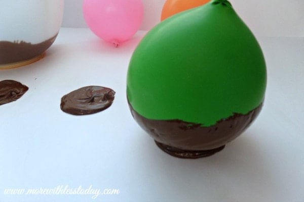 set the balloon inside the chocolate to make edible chocolate bowls