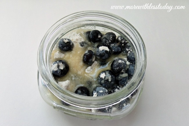 Making  Blueberry Dump Cake- Mini Blueberry Desserts, using mini mason jars for individual servings.