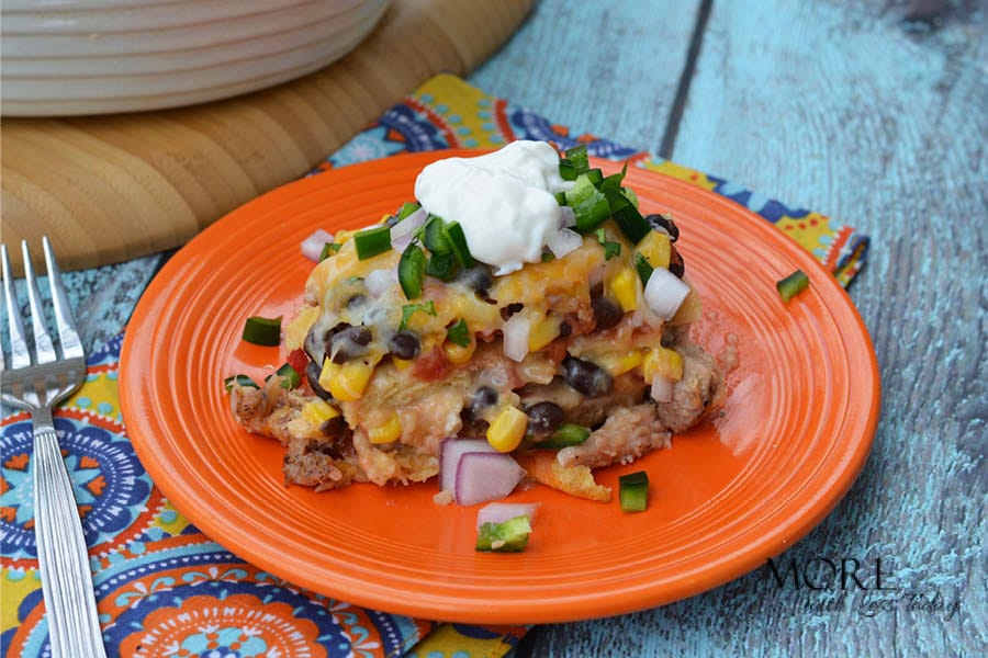 Four Cheese Bake recipe plated with a dollop of sour cream