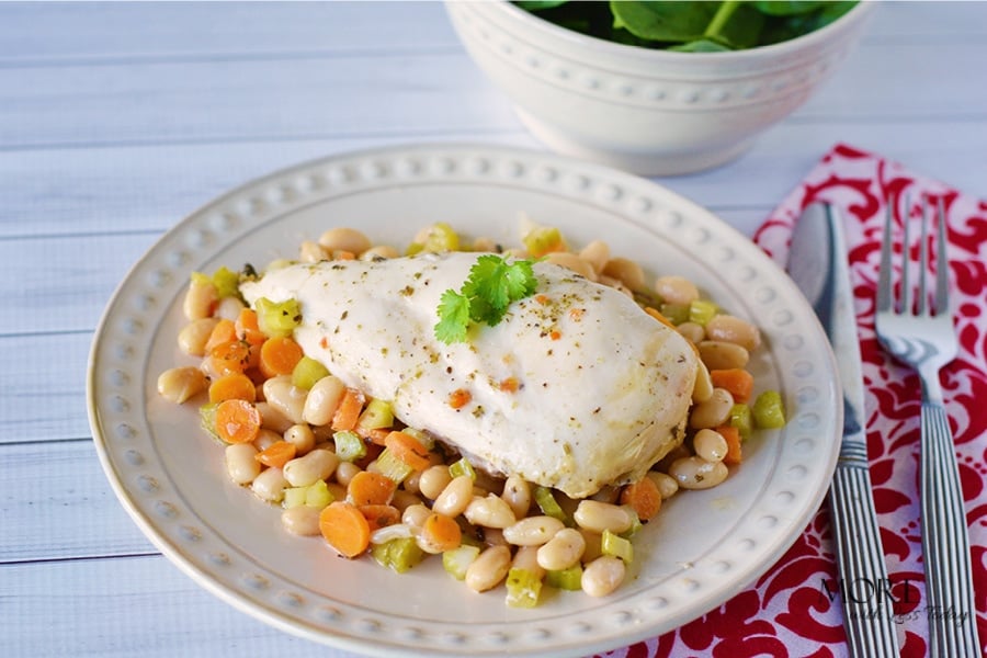 This easy Slow Cooker Chicken with Rosemary and White Beans recipe will have your guests asking for more!