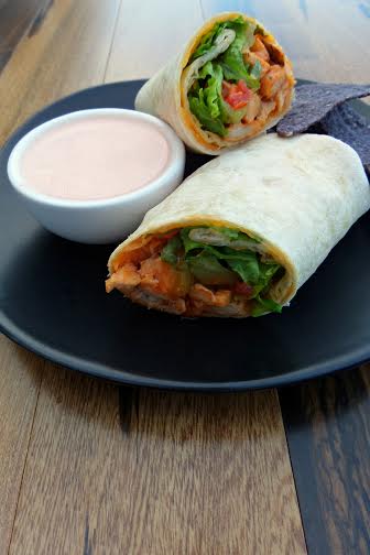 Mexican Chicken Wrap cut in half with dip