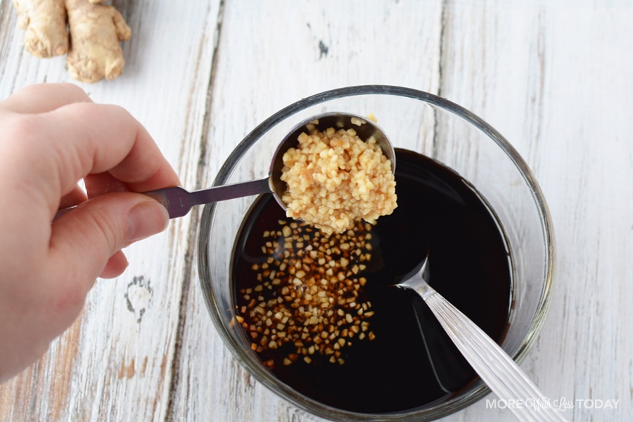 adding in minced garlic to the bowl