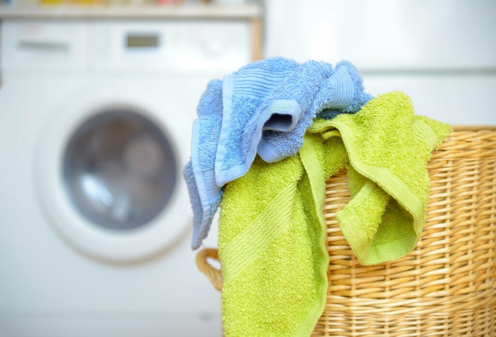 dirty towels in a laundry basket - genius uses for table salt
