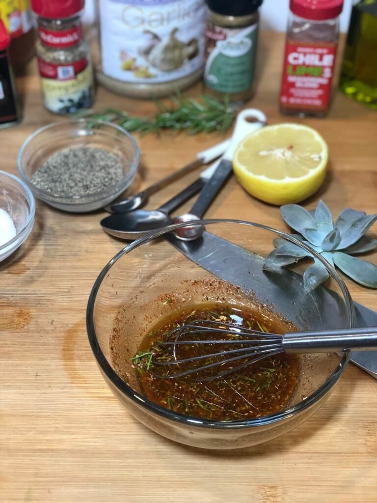 whisking a marinade for Shredded Pork Carnitas 