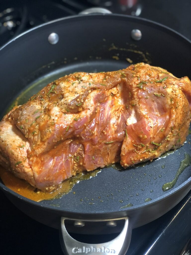 cooking the pork carnitas in a Calphalon pan