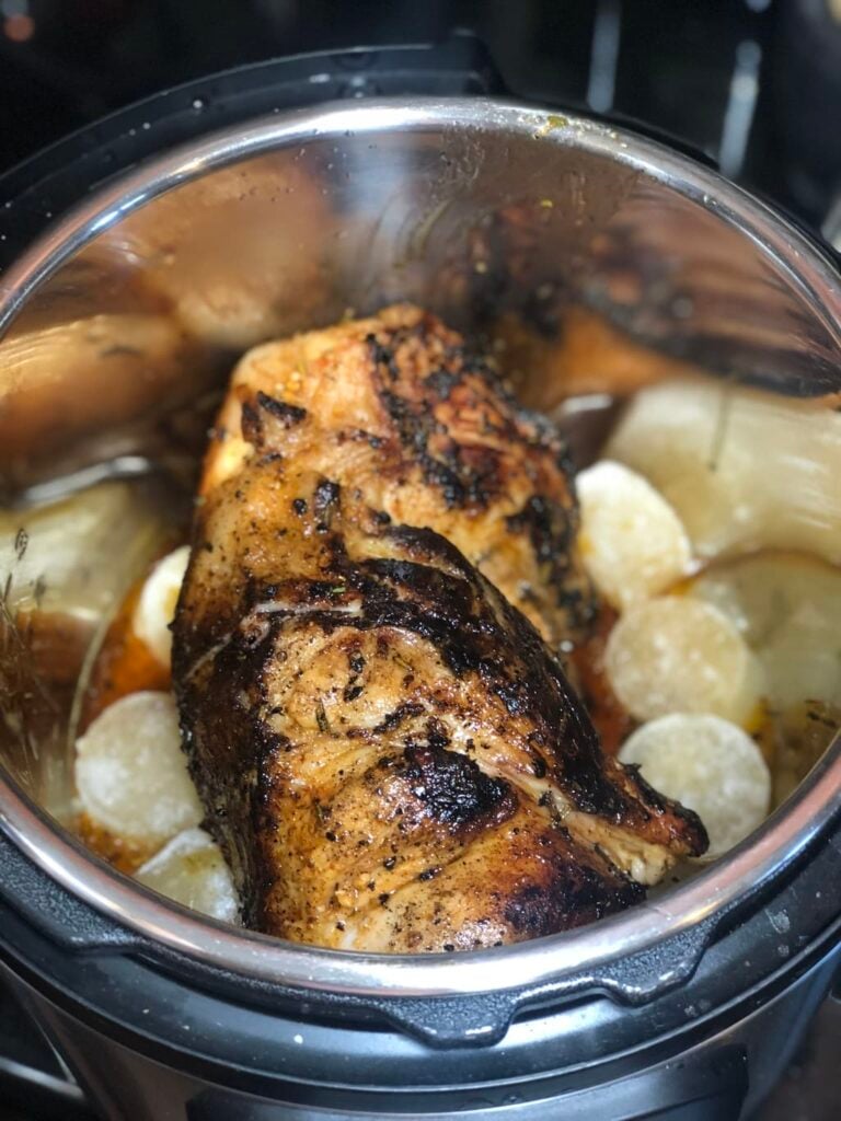 close up of pork carnitas in a slow cooker