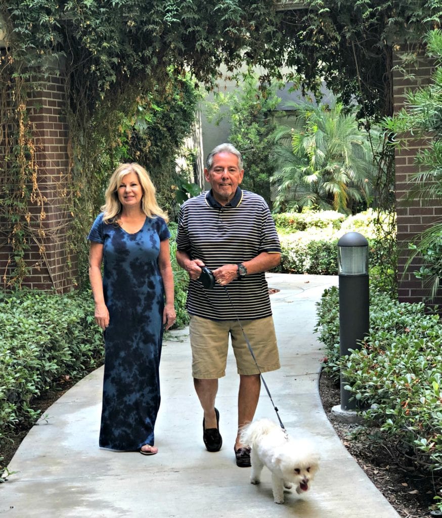 Lori Felix empty-nester walking dog with husband