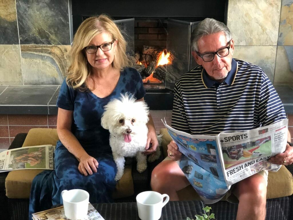 Lori Felix with rescue dog, Buddy and her husband