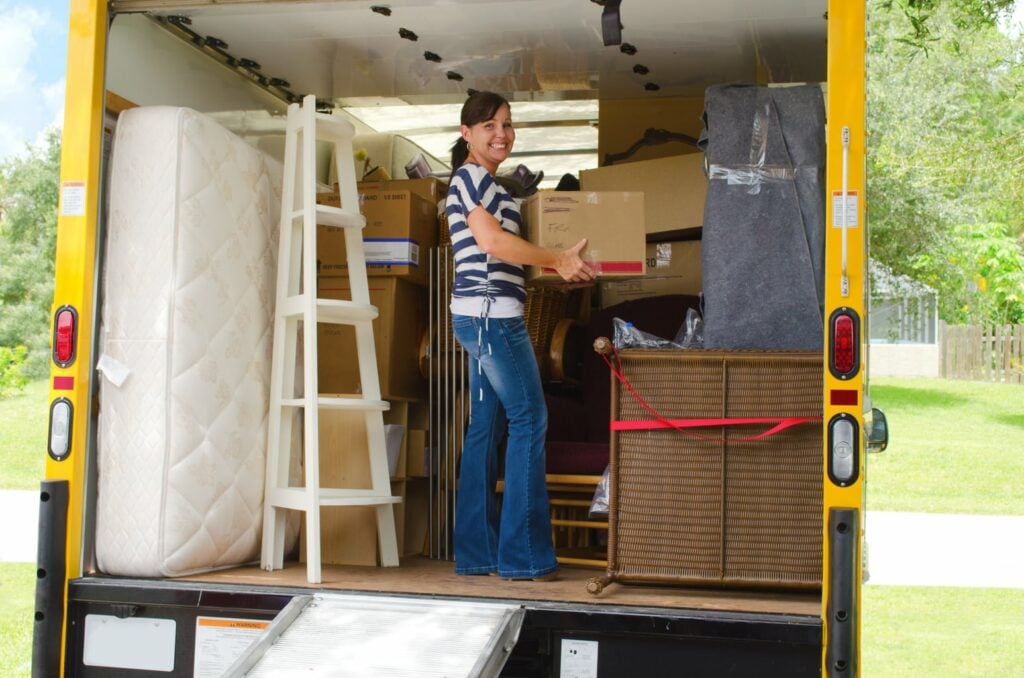 packing a moving truck with boxes and a bed