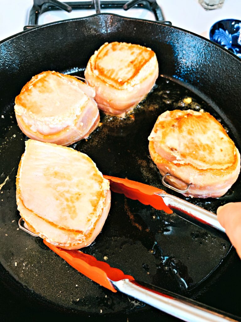 Bacon Wrapped Pork Chops with Garlic Butter Sauce