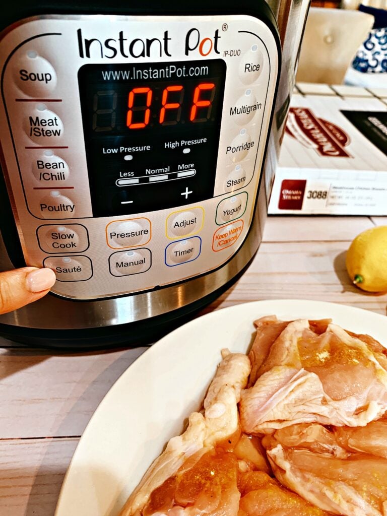 pointing to the saute feature on an Instant Pot
