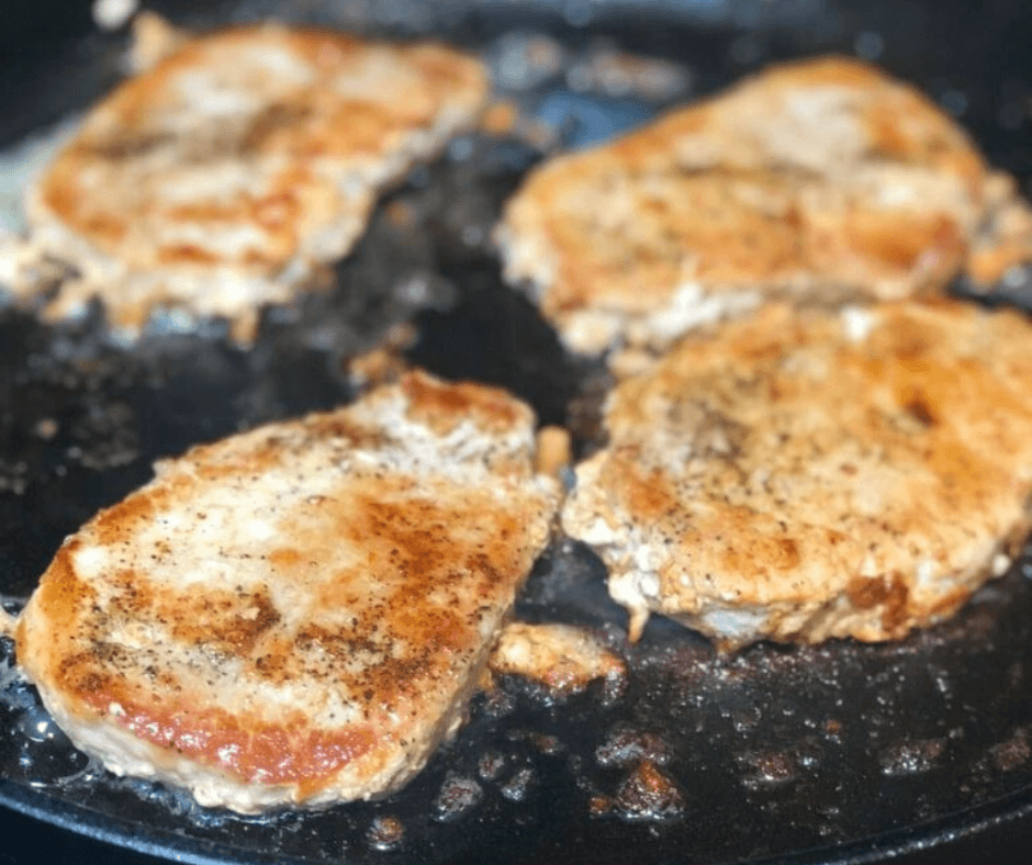 Boneless pork chops on a skillet