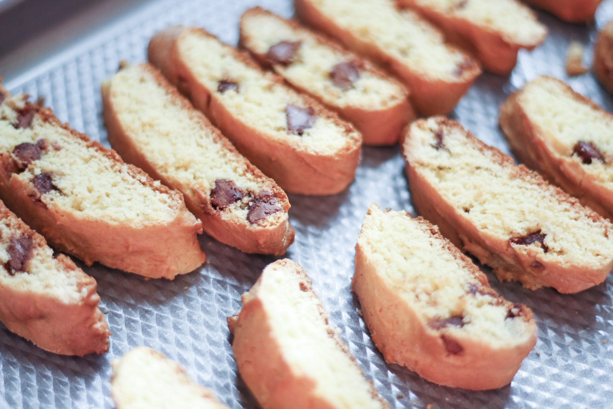 slices of Chocolate Chip Biscotti on a tray ready for baking