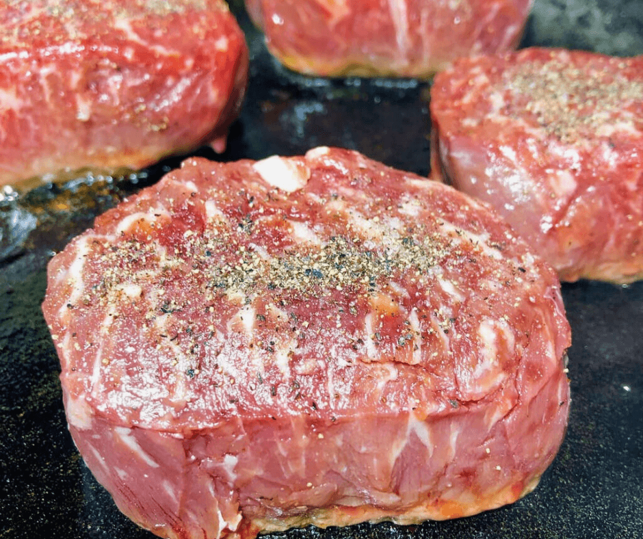 Seasoned Butcher's Cut Ribeye on a skillet