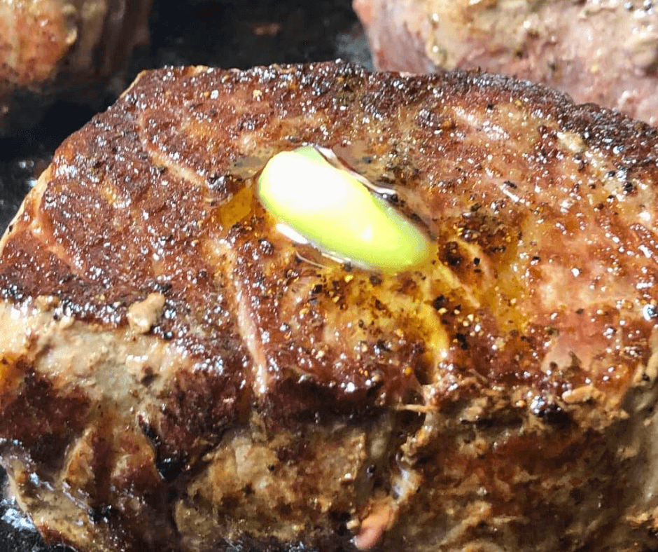 Steak slices being cooked with butter on top