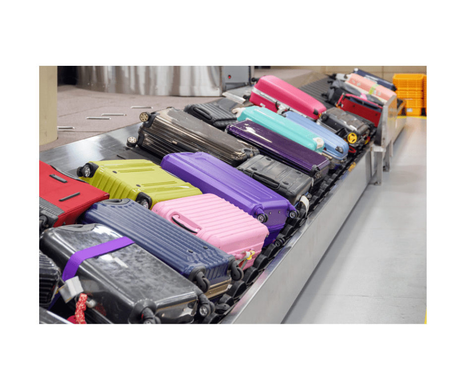 colorful suitcases on airport conveyer belt