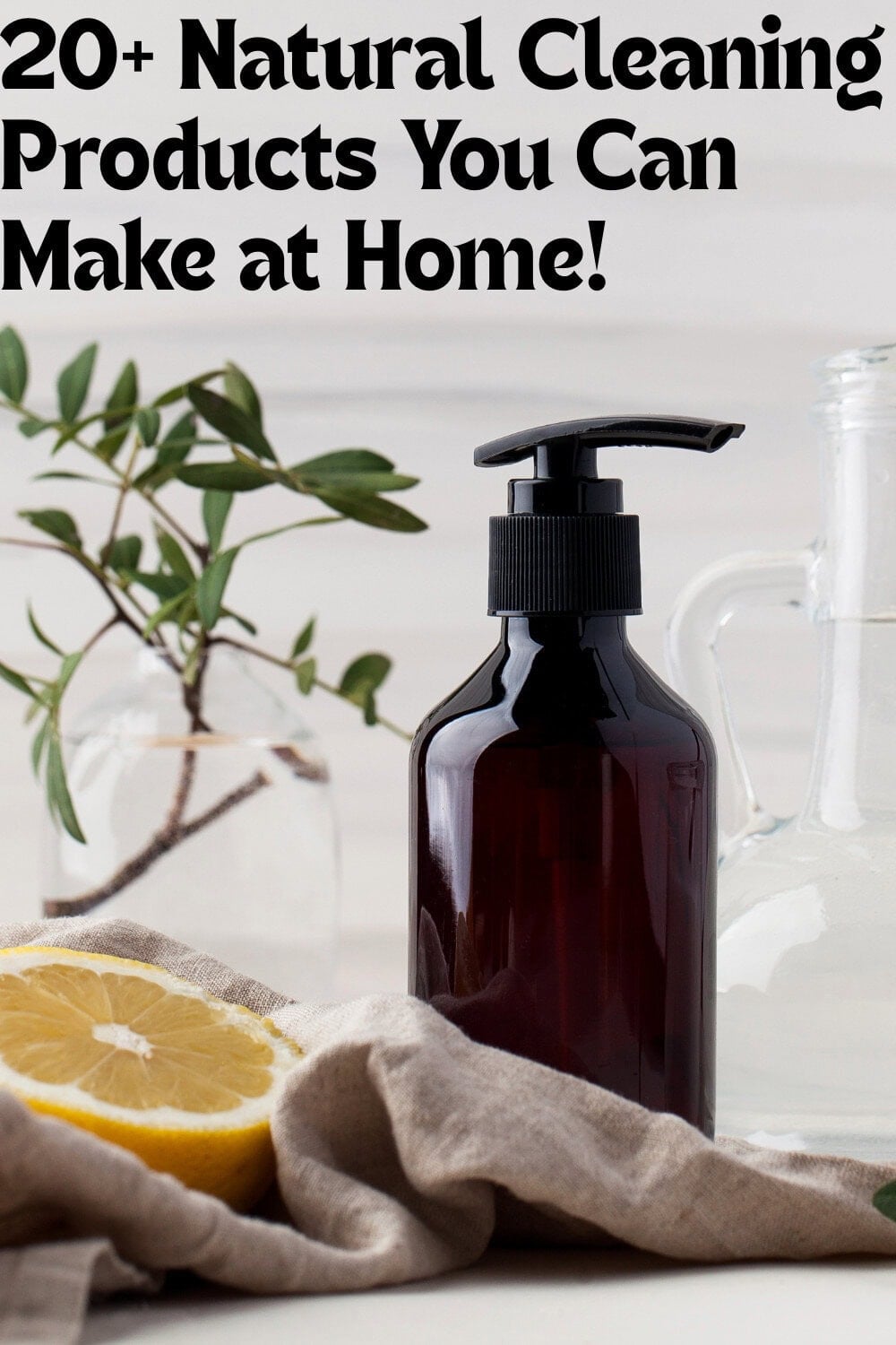 natural cleaning products diplayed with a lemon, a plant and a spray bottle