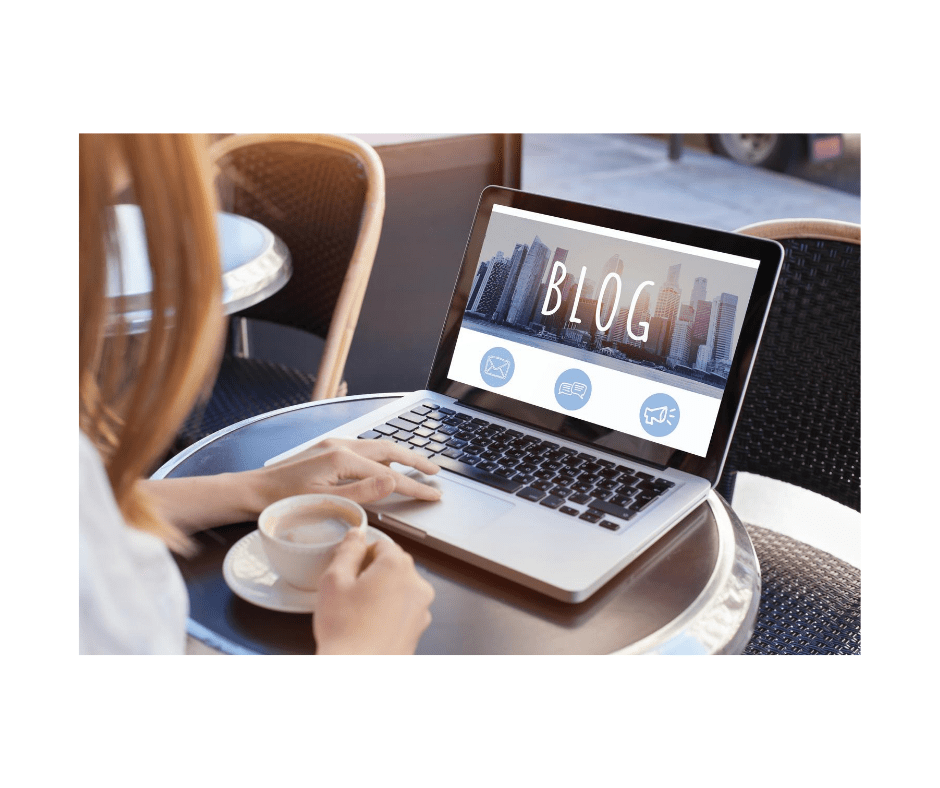 woman looking at computer screen learning how to start a blog