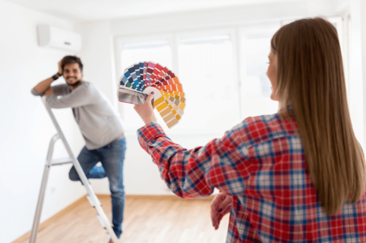 photo of a man and woman selecting paint swatches