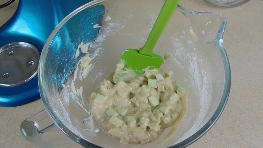 Sirring the apples and lemon juice for Homemade Apple Fritters Recipe with a Sweet Vanilla Glaze