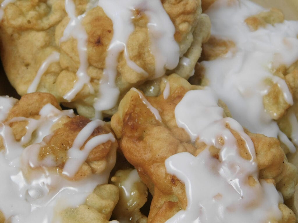 close up of Homemade Apple Fritters Recipe with a Sweet Vanilla Glaze