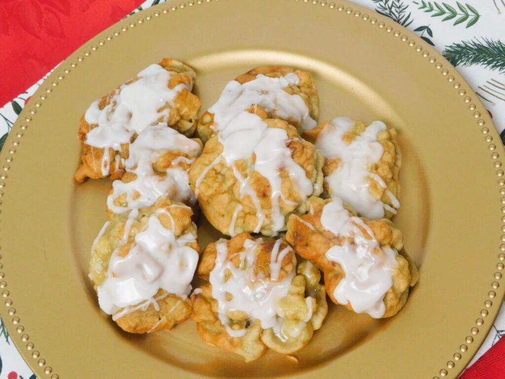 overhead view of homemade apple fritters on a gold plate