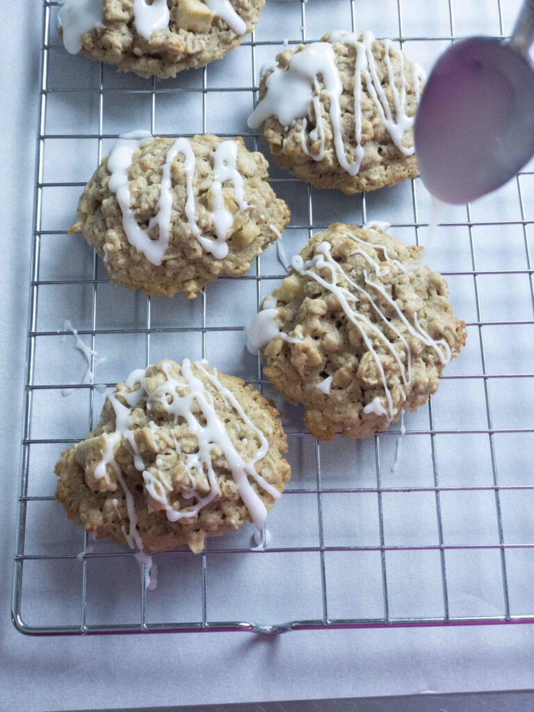 adding glaze to Apple Oatmeal Cookies