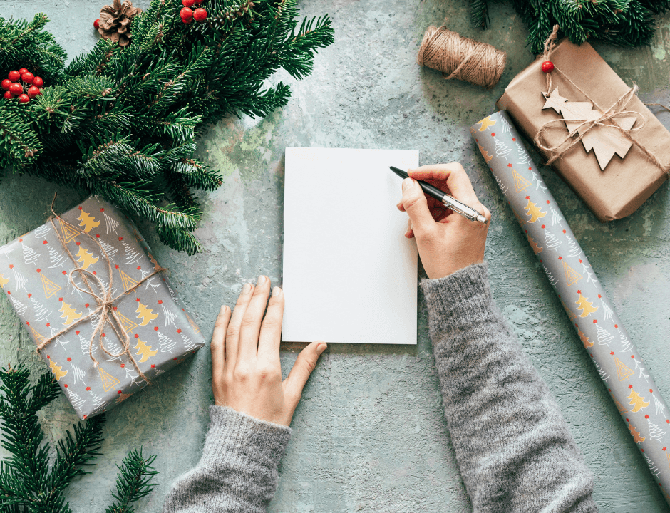 A woman writing a gift list