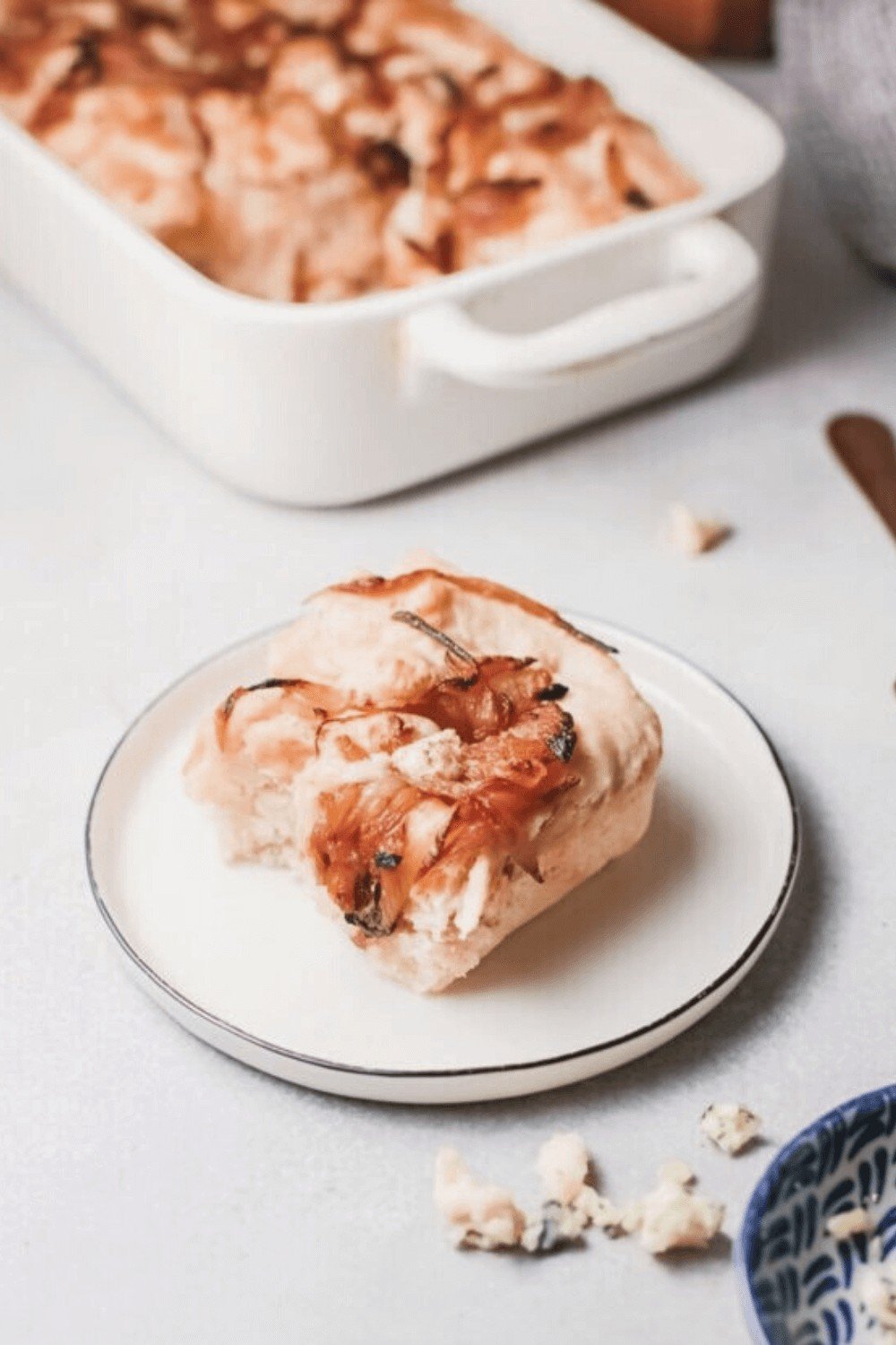 A slice of Caramelized Onion Focaccia Bread on a plate