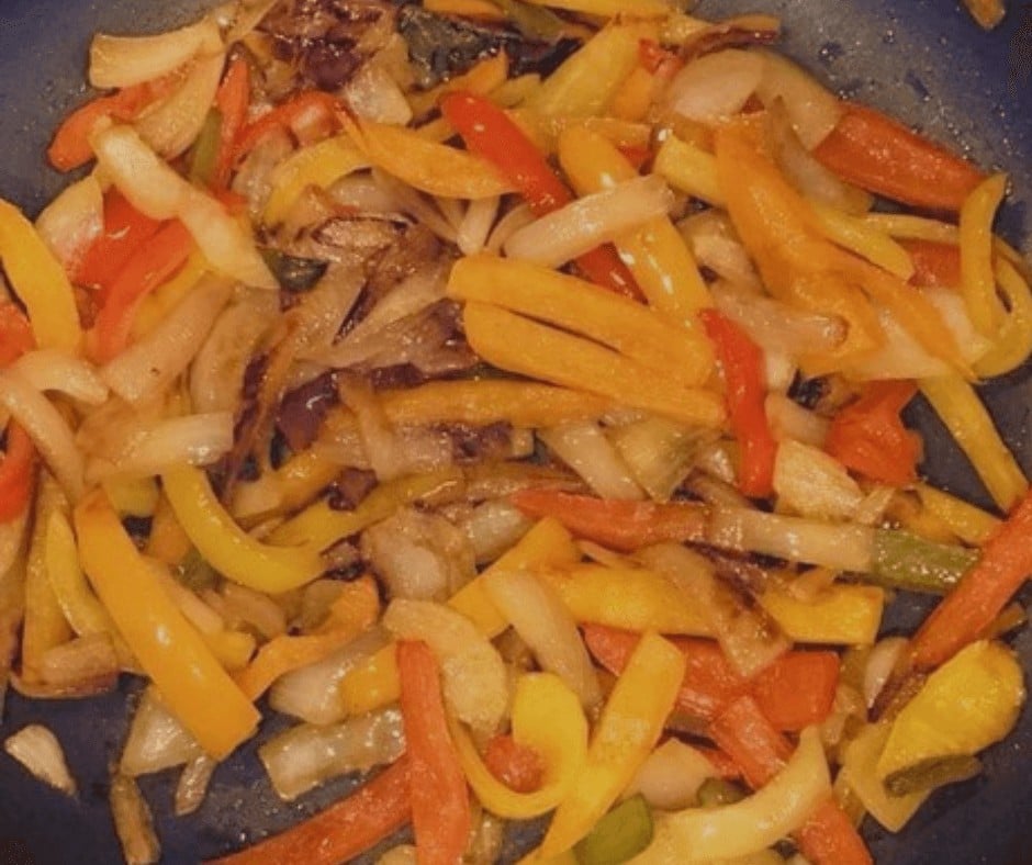 Fajita ingredients on a skillet