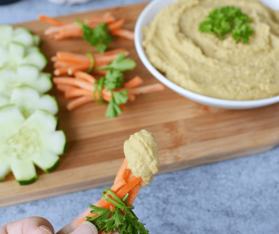Matchstick carrots dipped in Easy Homemade Hummus