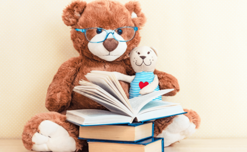 Two plush toys with three books in front