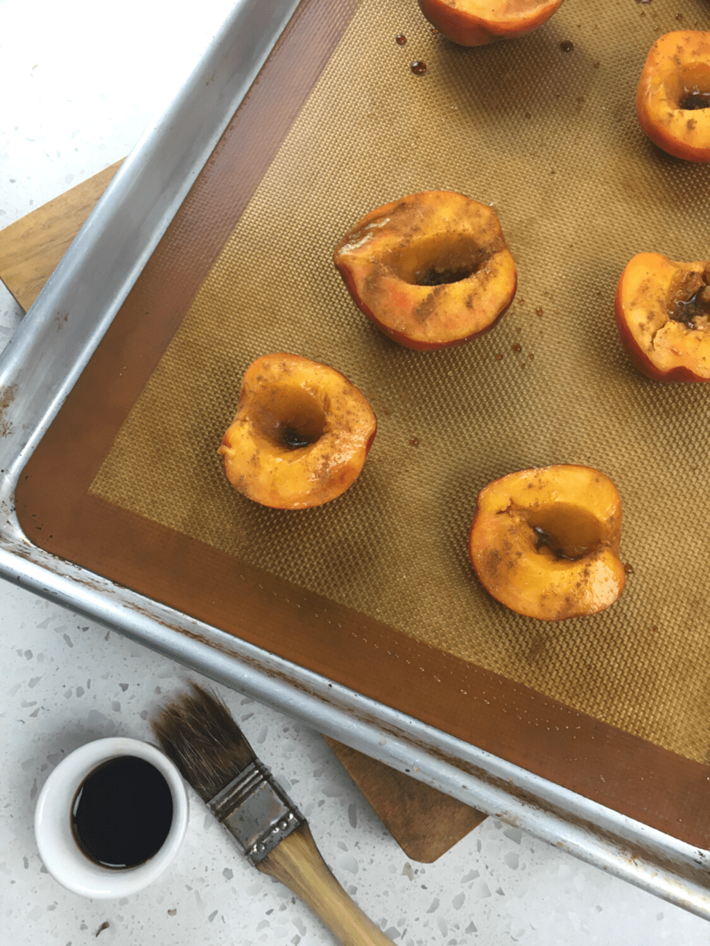 Balsamic Baked Peaches on baking sheet