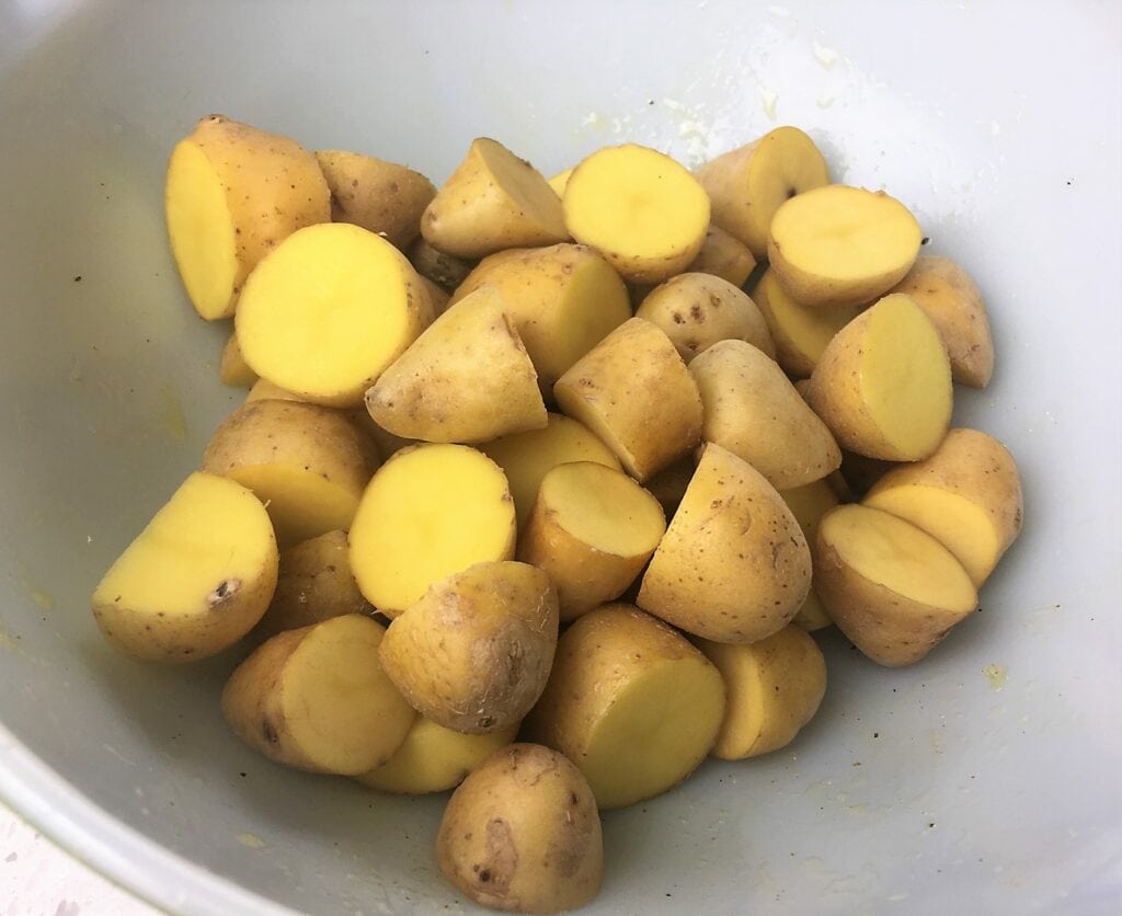 chopped potatoes in a white bowl