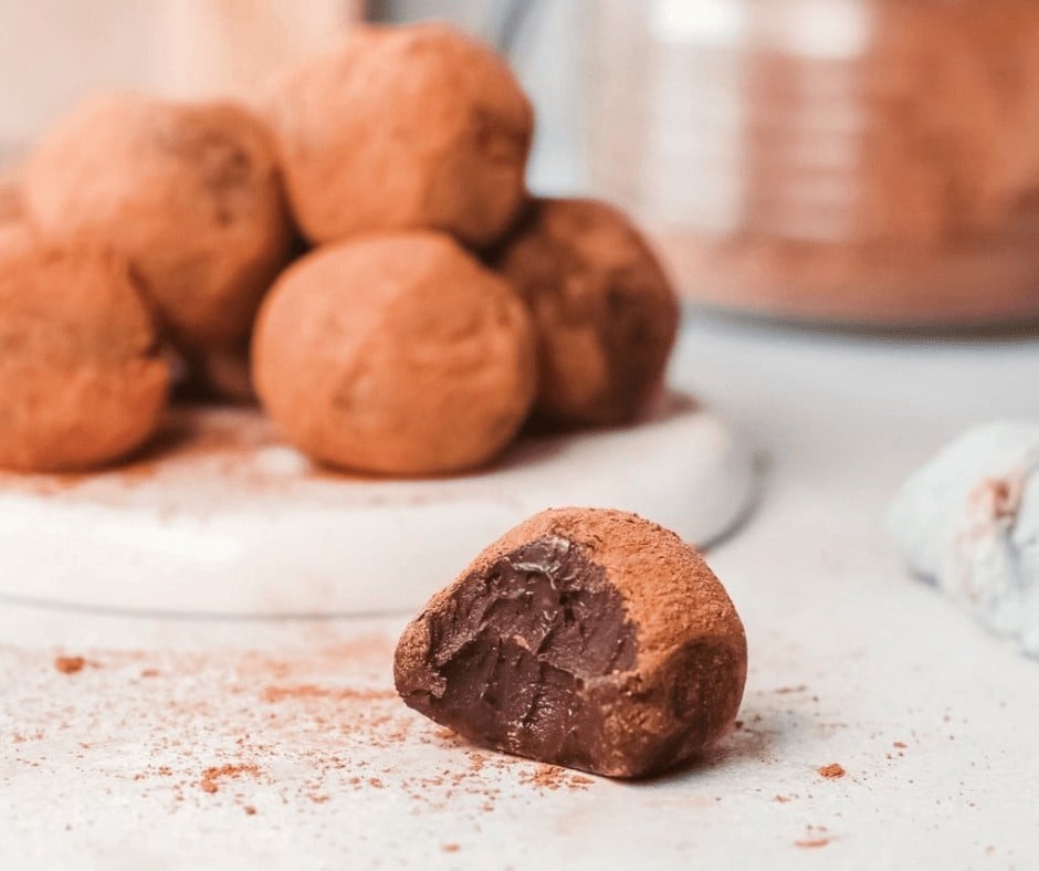 A closeup of a Boozy Chocolate Truffle with a bite