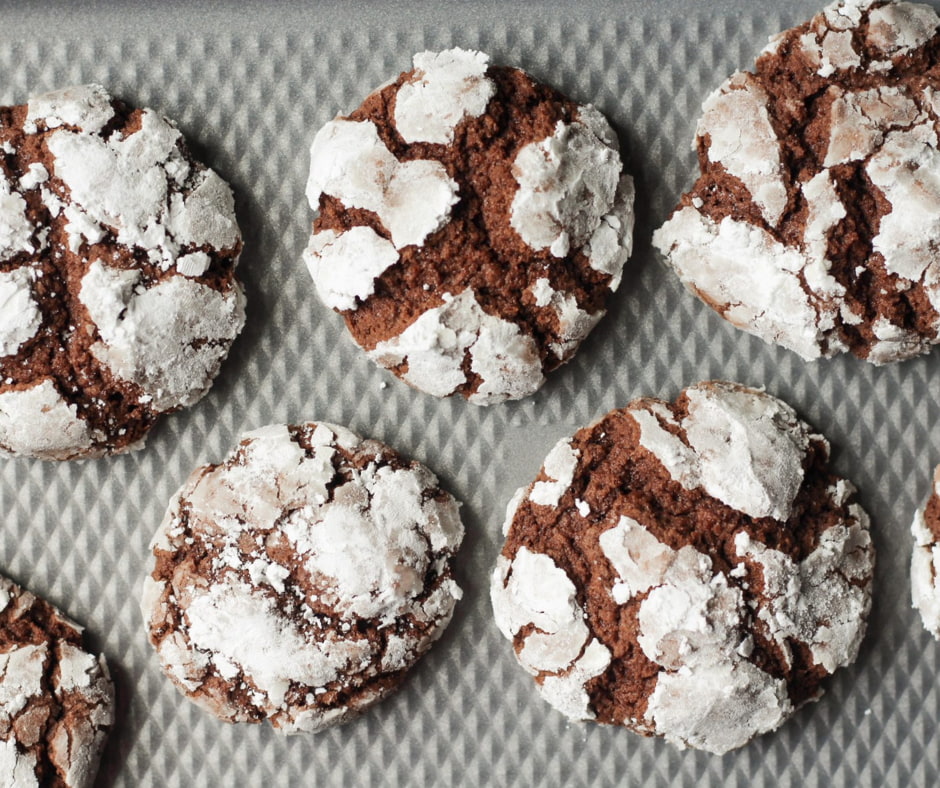 Freshly baked Chocolate Crinkle Cookies on a baking tray