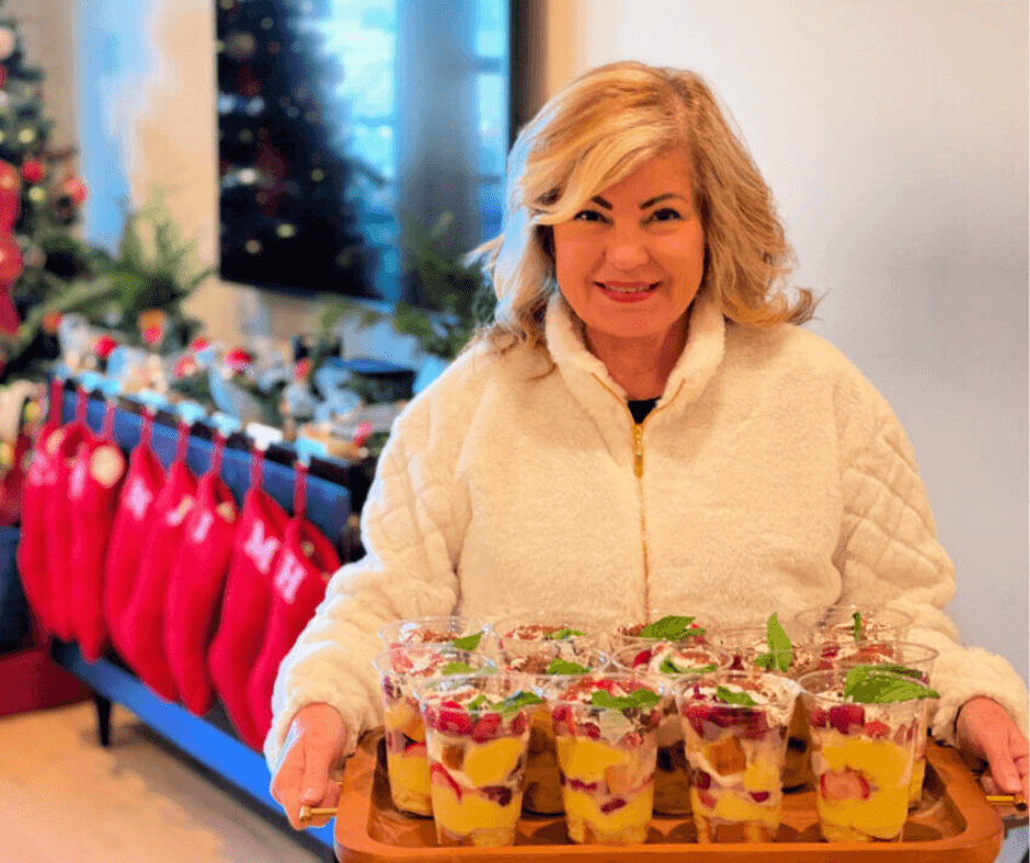 Lori holding a tray of Individual Trifle Cups