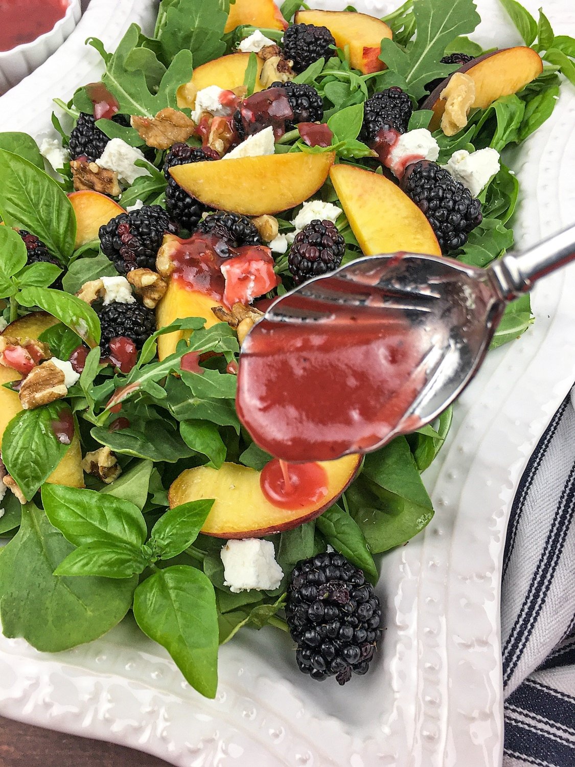 Putting Blackberry Basil Vinaigrette on the Peach Blackberry Salad