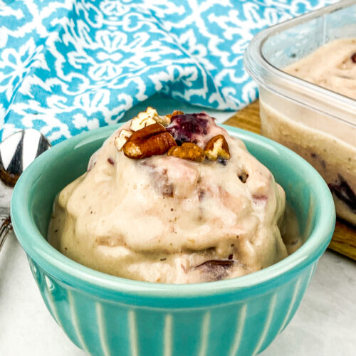 cherry pecan ice cream on a small teal bowl