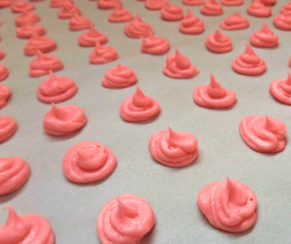 Freshly-made Cinnamon Valentine Candy Kisses on a baking sheet