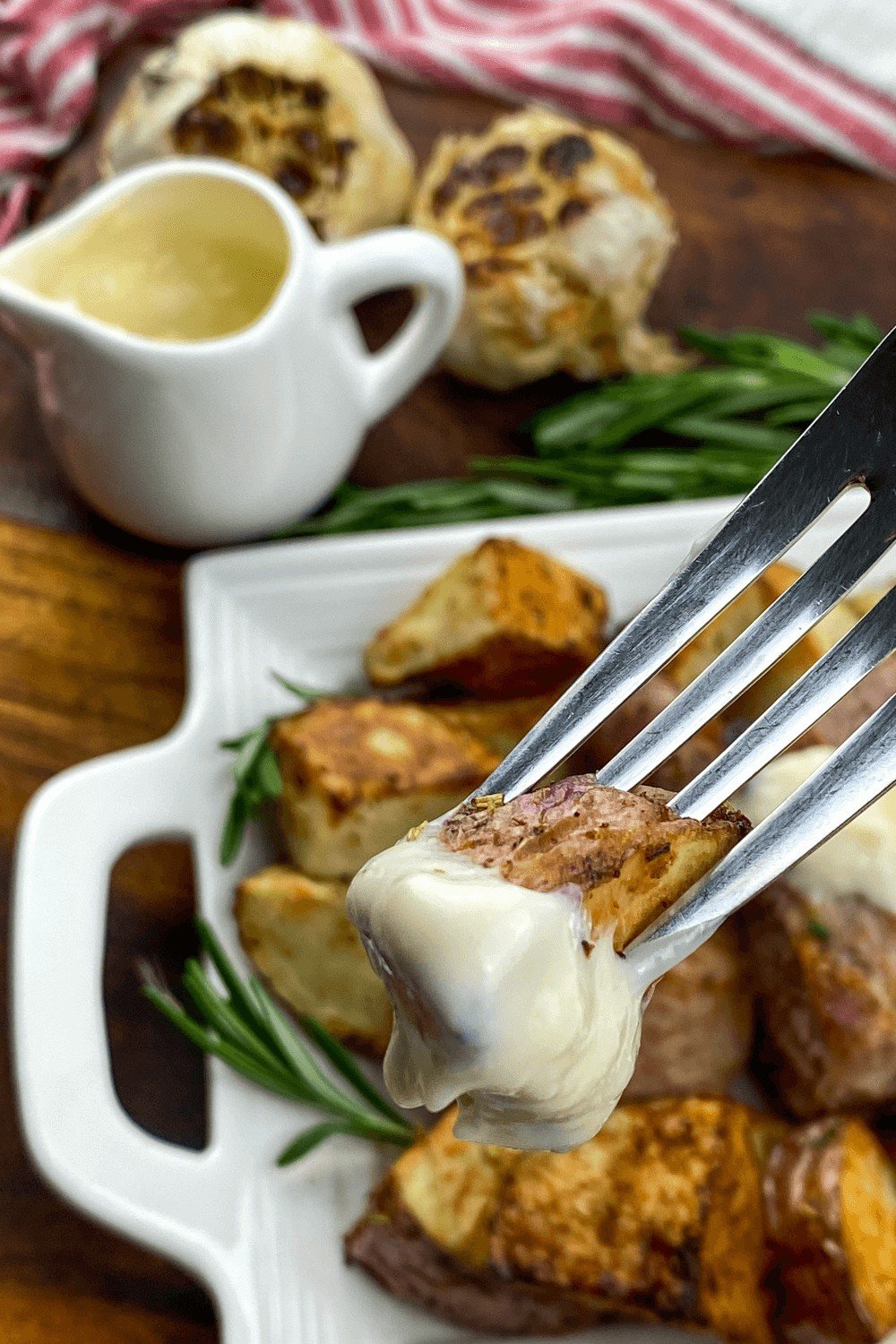 A piece of Fryer Pork Tenderloin dipped on Garlic Sauce