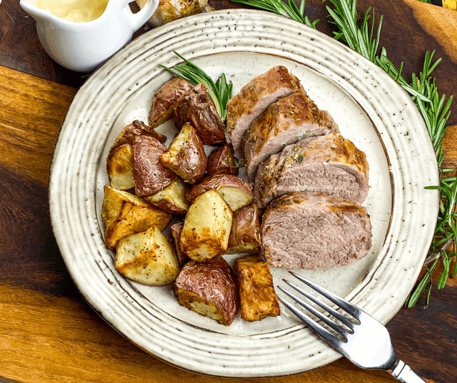 A serving of Air Fryer Pork Tenderloin on a white plate