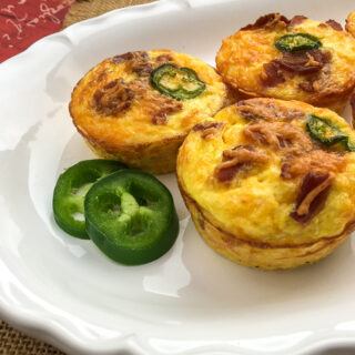 cheesy cauliflower muffins on a white plate