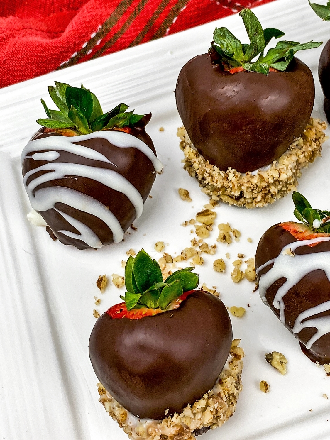 chocolate covered strawberries with different toppings
