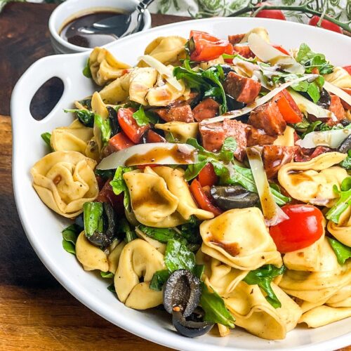 tortellini antipasto pasta salad on white salad bowl