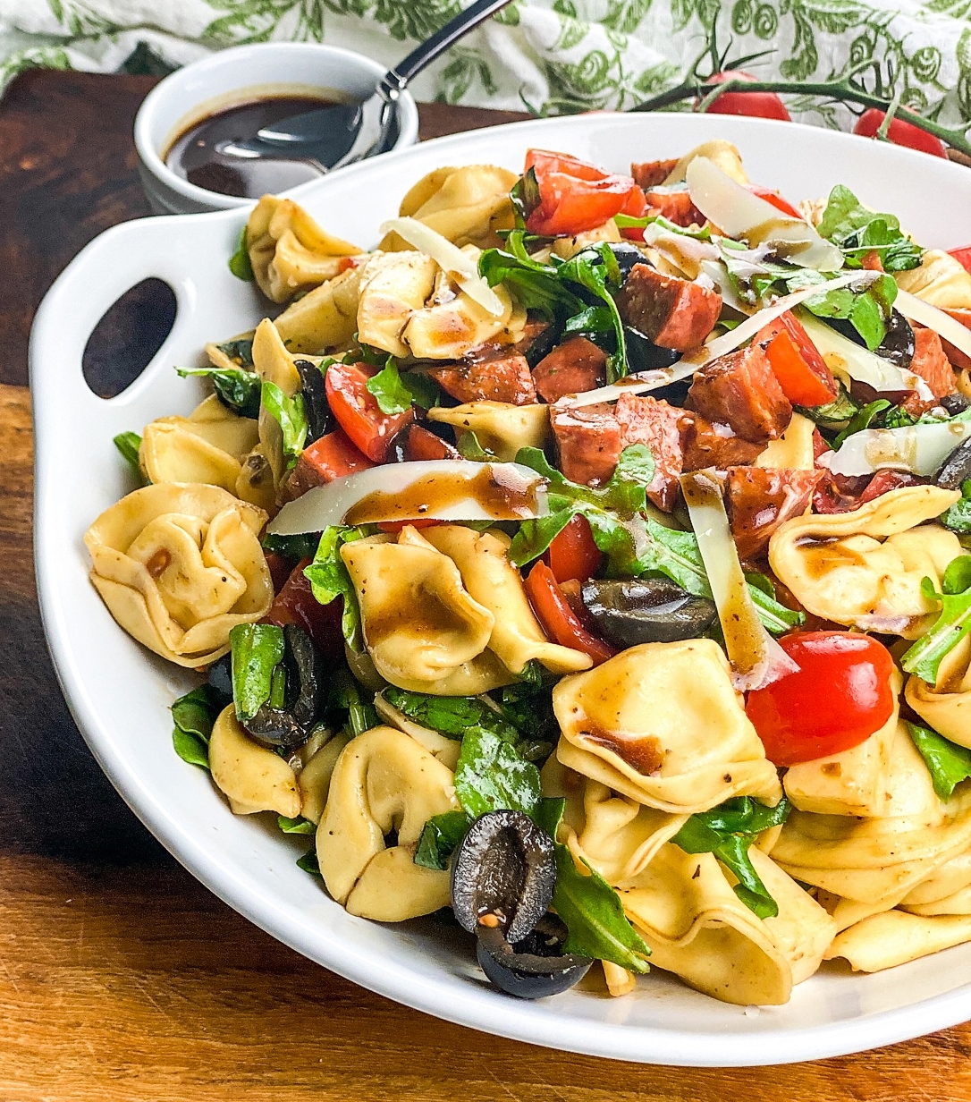 tortellini antipasto pasta salad on white salad bowl