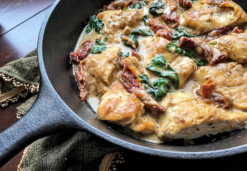 Chicken with Creamy Pecorino Sauce on a skillet