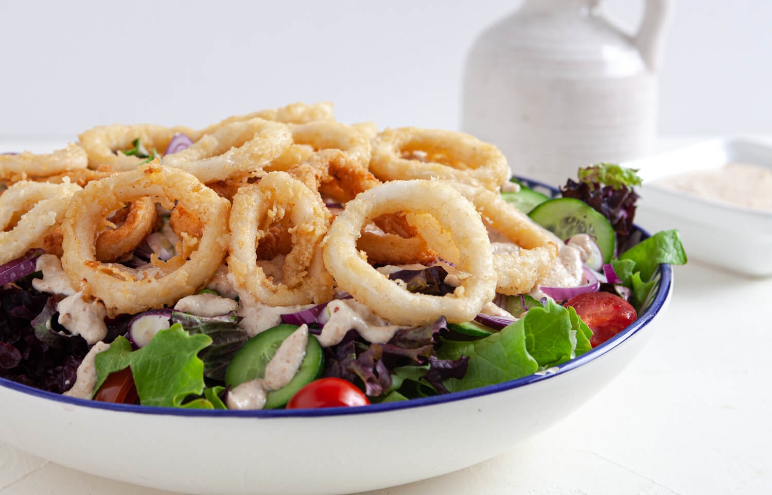 Best Calamari Salad on a white bowl