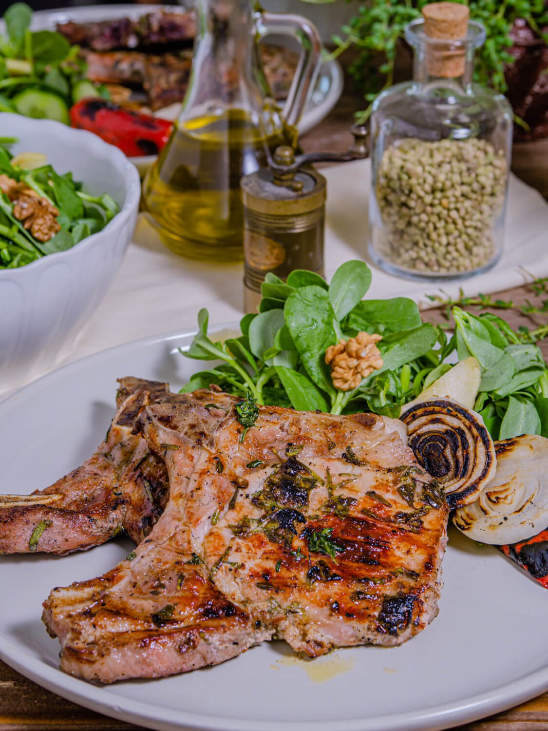 Marinated Grilled Pork Chops on a white plate