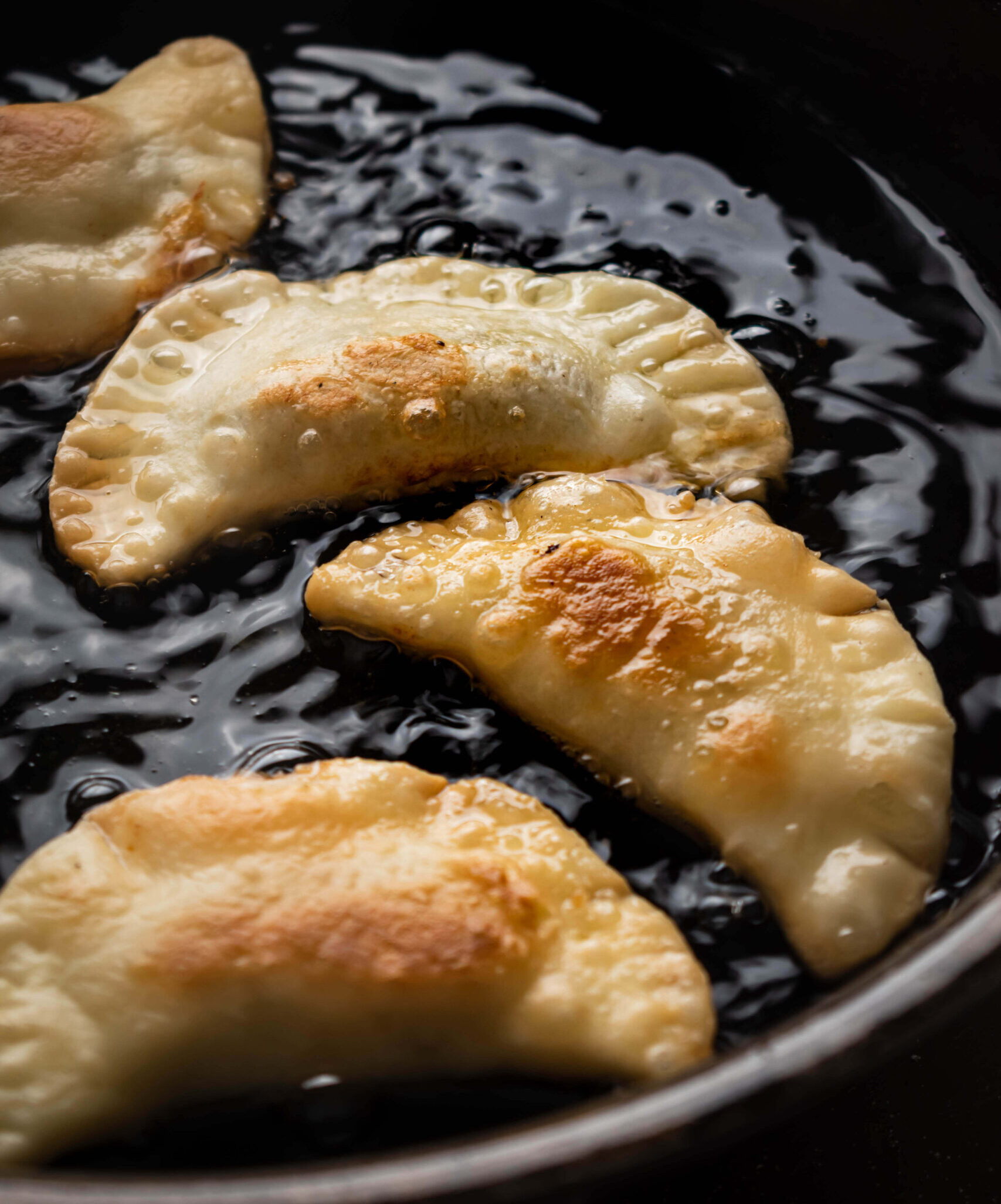 cooking the jamaican patties in oil